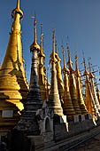 Inle Lake Myanmar. Indein, on the summit of a hill the  Shwe Inn Thein Paya a cluster of hundreds of ancient stupas. Many of them are ruined and overgrown with bushes.